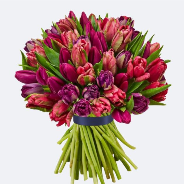 Hand-Tied Deep Pink and Purple Tulip Bouquet 1 A vibrant and fresh birthday tulip bouquet featuring deep pink and purple flowers with organic green stems.