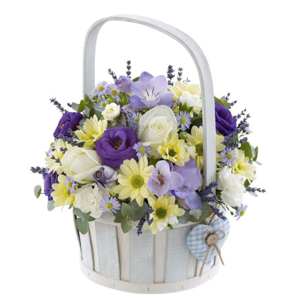 Flowers for new Baby Boy basket featuring purple roses, yellow daisies, and lavender in a white wicker basket.