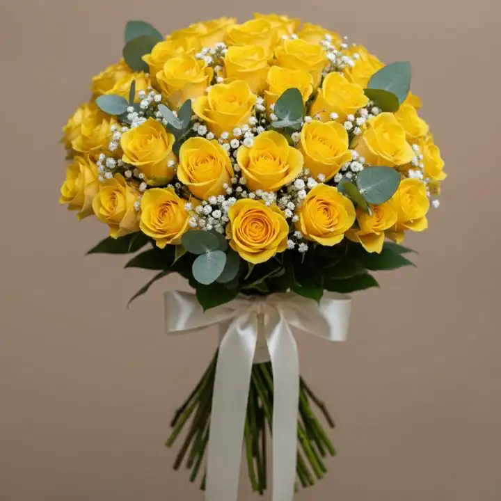 Yellow Jessica - 50 Fresh Yellow Roses Hand-Tied Bouquet 1 A round bridal bouquet featuring 50 yellow roses delivery with white baby's breath and fresh green eucalyptus leaves.