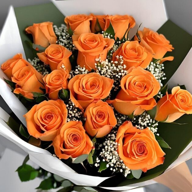 A stunning, elegant arrangement of fresh orange roses paired with delicate white gypsophila (baby's breath), perfectly suited for a natural, organic bridal look.
