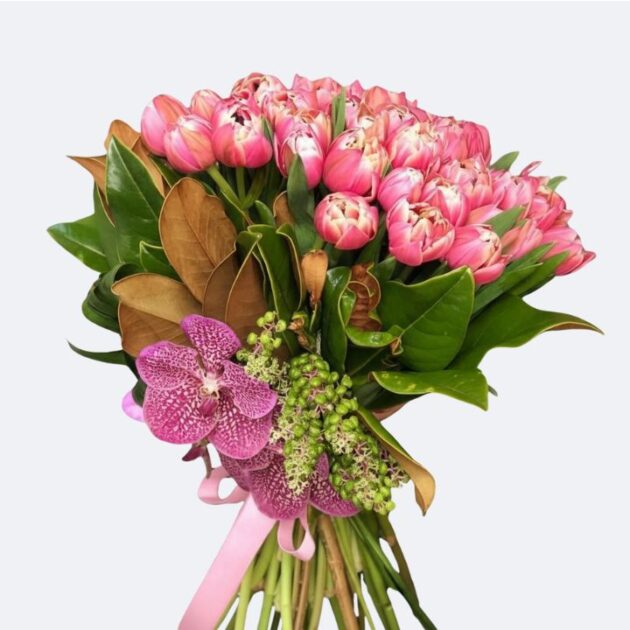 Hand-Tied Tulips and Orchids Bouquet with Pink Ribbon 1 A vibrant Tulips and Orchids Bouquet featuring fresh pink tulips and purple vanda orchids tied with a silk ribbon.