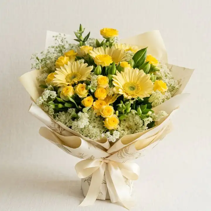 Sunlit Yellow Gerbera Daisy & Roses Bouquet 1 A hand-tied gerbera daisy and roses bouquet featuring bright yellow petals and elegant white blossoms in natural light.
