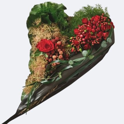 Heart Shaped Funeral Tributes featuring a mix of deep red roses, vibrant red berries, and textured green moss, suitable for expressing sympathy and love at a memorial service.