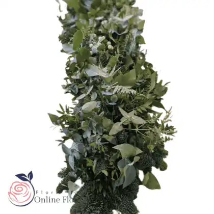 Elegant Christmas garland with greenery and berries draped along a staircase railing