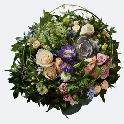 Small Funeral Posy featuring elegant pink and peach roses, mixed foliage, and delicate accent flowers, suitable for a heartfelt memorial tribute.