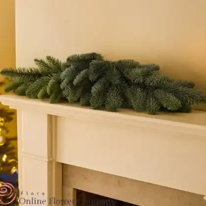 Premium 9-foot scented Christmas garland featuring pinecones, red velvet ribbons, and realistic juniper berries, perfect for stairs or mantel.