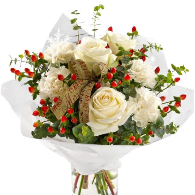 Elegant white roses and carnations in a hand-tied bouquet with vibrant red winter berries, eucalyptus, and a festive "Merry Christmas" ribbon, wrapped in white paper. Buy Perfect Christmas Bouquet Next day Delivery